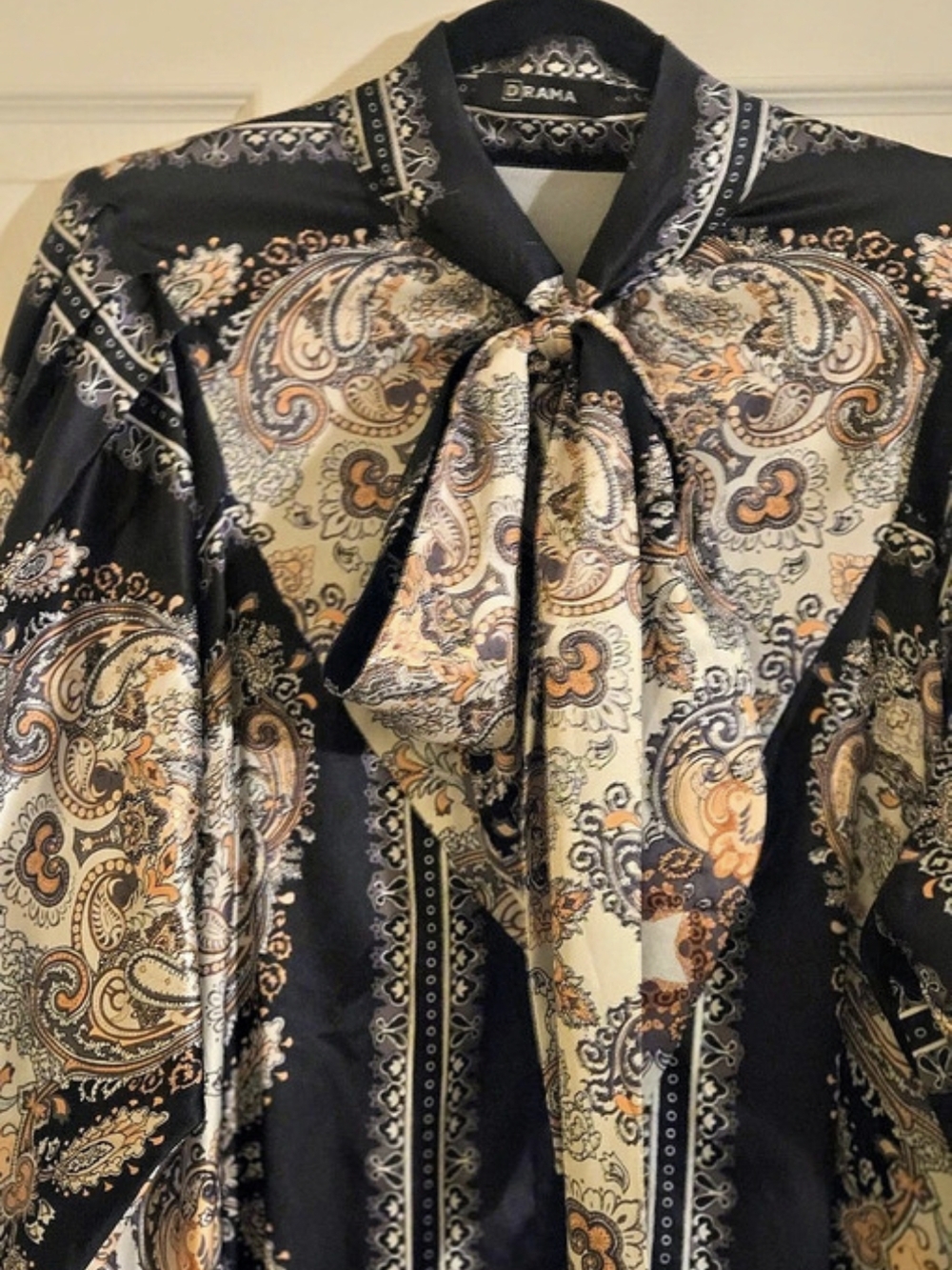 DRAMA Paisley Tie Neck Flowy Button Front Dress in Black, Gold & Beige Print.